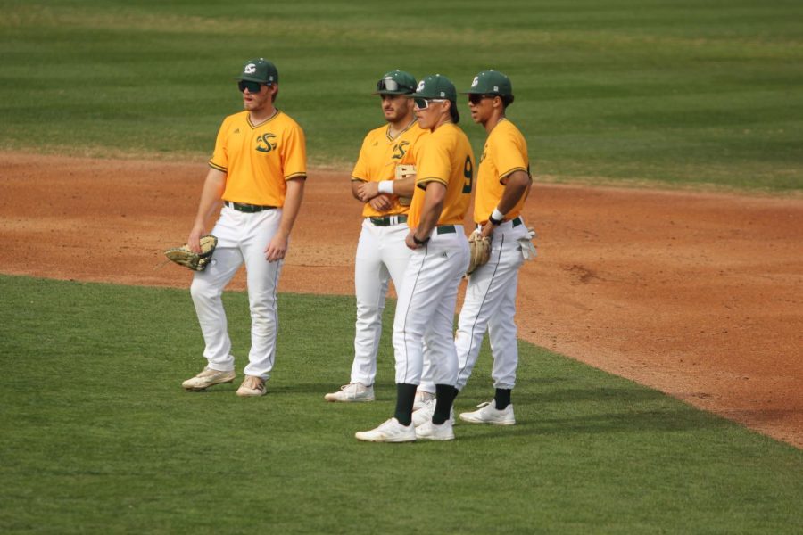(L-R) Freshman first baseman Braden Frank, junior third basemen Jorge Bojorquez, freshman shortstop Wehiwa Aloy and junior second basemen Josh Rolling chat during a pitching change on Saturday, Feb. 18, 2023, at John Smith Field. Sac State rallied from a 4-1 deficit to beat North Dakota State 8-6, with the Hornets offense scoring 29 runs on the weekend to push them to 3-1 to start the year. 
