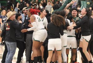 Sacramento State women’s basketball team celebrates after setting a school record in wins Thursday, Feb. 23, 2023. In head coach Mark Campbell’s second year as the Sac State head coach the Hornets have a new school-high in wins.