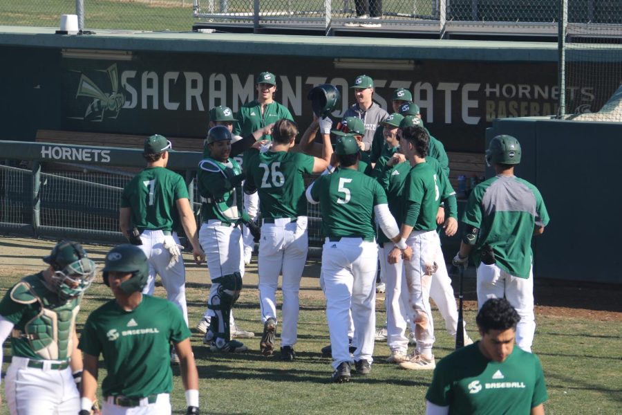 Redshirt+freshman+Griffin+Harrison+celebrates+with+teammates+after+hitting+a+homerun+during+an+intersquad+game+Friday%2C+Feb.+10%2C+2023+in+Sacramento.+Sac+State%E2%80%99s+baseball+season+starts+Friday+with+a+home+series+at+John+Smith+Field.