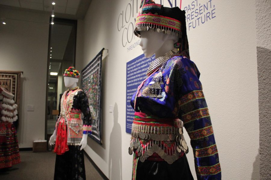 Mannequins throughout the Library Gallery display colorful fabrics and intricate details at Cloth as Community on Thursday, Feb. 2, 2023. The items are said to hold the past, present and future as Hmong culture and clothes are passed down generation to generation.