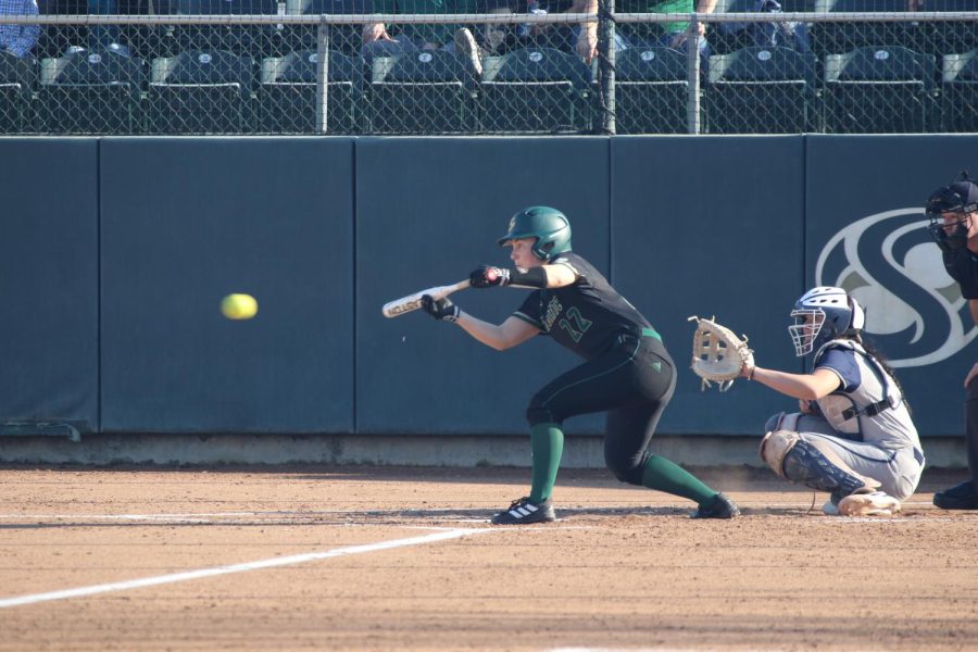 Senior outfielder Samantha Parish bunts the ball before running the bases again at the softball game on Thursday, Feb. 9, 2023 in Sacramento. Parish started in all 55 games of the 2022 season. Eleven were at catcher, the other 44 were at center field. 