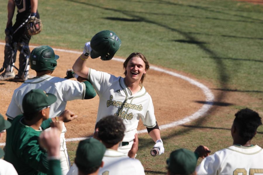 Junior right-fielder Garet Crenshaw celebrates his first home run of the season with teammates Friday, March 3, 2023, at John Smith Field. Crenshaw was one of three players to hit a homerun in a 9-4 win over Nevada.
