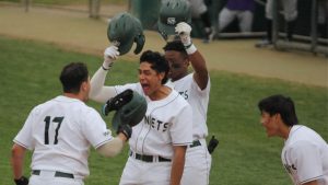 (L-R) Senior first baseman Martin Vincelli-Simard celebrates his eighth inning grand slam with junior outfielder Cesar Valero, sophomore outfielder Jeffery Heard and freshman shortstop Wehiwa Aloy Saturday, March 18, 2022, at John Smith Field. Vincelli-Simard’s grand slam was the second of the day for the Hornets and sealed the lone win of the weekend for the Hornets, 13-8. 