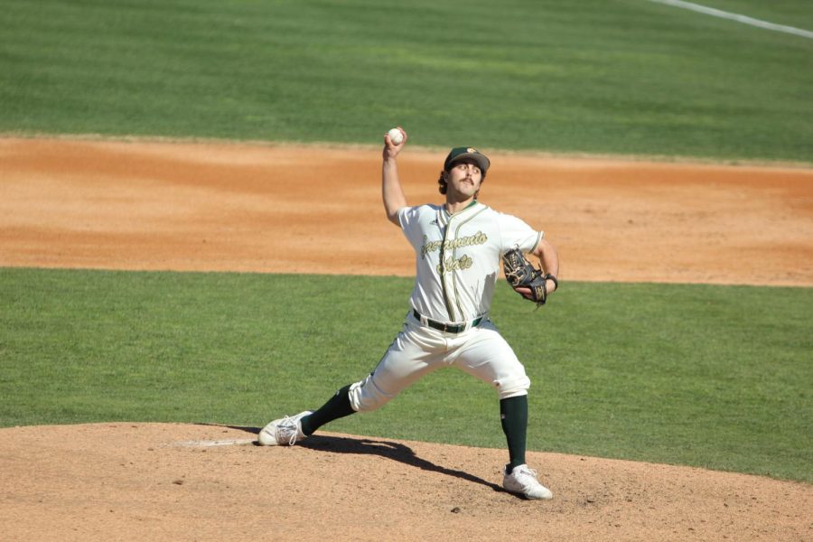 Junior right-handed pitcher Cooper Rons delivers a pitch at John Smith Field  Friday, March 3, 2023. Rons made two appearances on the weekend, pitching five and one third innings, allowing seven hits and seven earned runs. 