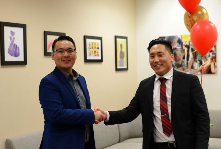 Director of Educational Equity Access and Equity Strategist Dr. Chao Vang (left) shaking hands with Asian Pacific Islander Desi American Center coordinator Andrew Yang in the APIDA Center during its grand opening on Tuesday, Feb.28, 2023.