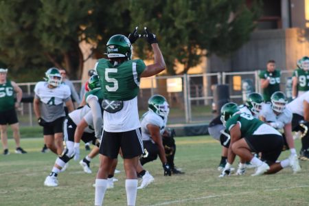 Marte Mapu makes a hand signal to the defense at Sacramento State on Wednesday, Oct. 12, 2022. Mapu became the highest draft pick in Sac State history when he was selected by the New England Patriots at 76th overall. 