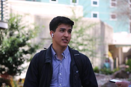 D’Angelo Carias, a third year business major, in the library quad April 5, 2023. Carias said he dealt with delays receiving his Middle Class scholarship this semester. As a result, Carias said he was forced to take out a loan.
