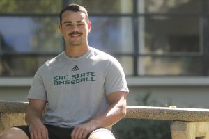 Martin Vincelli-Simard sits on a bench in front of Lassen Hall Thursday, Oct. 6, 2022. The fifth-year catcher is third among qualified Sac State batters with a .309 batting average over 27 games.