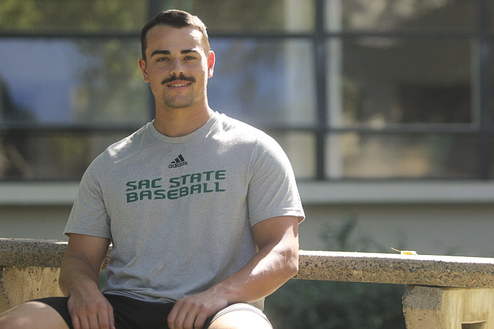 Martin+Vincelli-Simard+sits+on+a+bench+in+front+of+Lassen+Hall+Thursday%2C+Oct.+6%2C+2022.+The+fifth-year+catcher+is+third+among+qualified+Sac+State+batters+with+a+.309+batting+average+over+27+games.