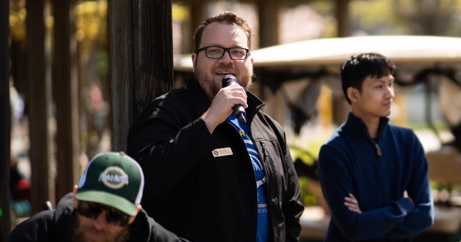 KSSU staff member Aaron Wall (middle) holding a microphone at an event in the Library Quad Monday, March 27, 2023. Wall is accused of making a Nazi salute during the recording of a podcast at KSSU.