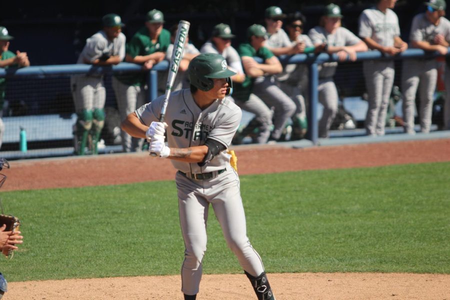 [FILE] Freshman shortstop Wehiwa Aloy takes an at bat versus UC Davis Tuesday, April 11, 2023. With his fifth inning home run on Saturday, Aloy became the all time leader in Sacramento State’s Division I history for  home runs hit by a freshman with 12.