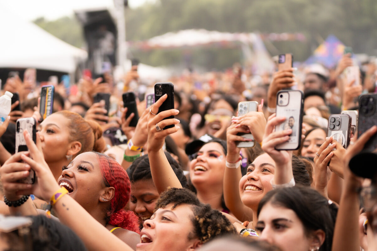 The crowd cheers with their phones in the air at the Blume Stage at Sol Blume Saturday Aug. 19, 2023. Sol Blume is an annual hip-hop, soul and R&B music festival in Sacramento.