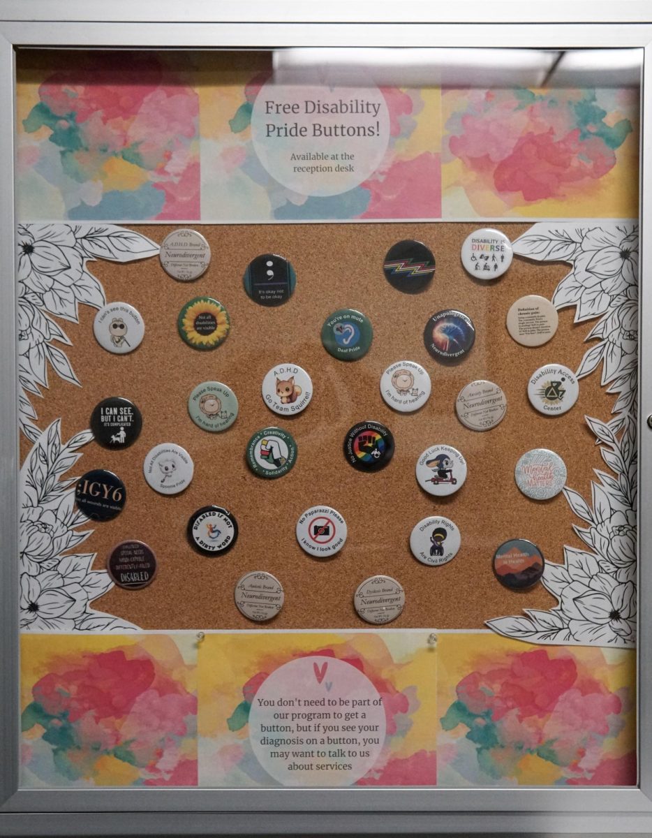 Disability pride pin board located in the Disability Cultural Center, Thursday, Sept. 7, 2023. These pins, available for free, feature visible and invisible disabilities accompanied with empowering phrases. 
