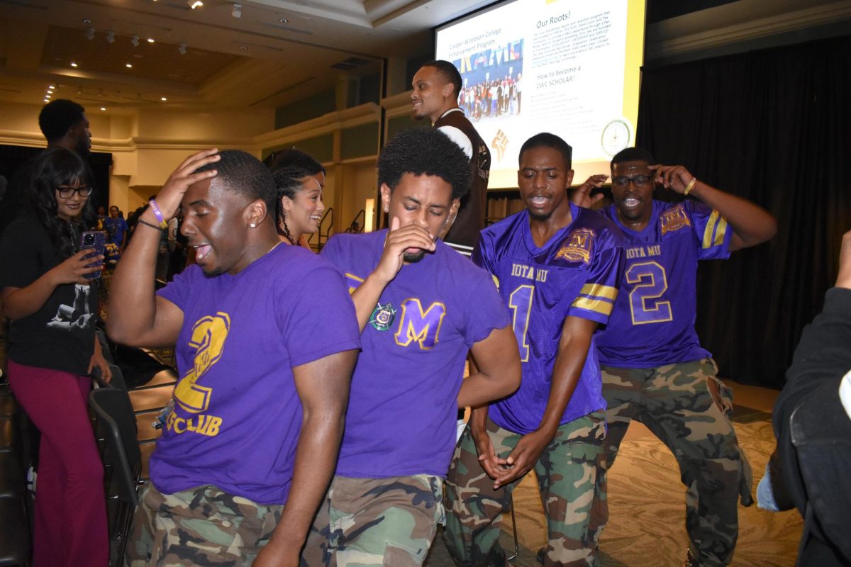 Members of the Iota Mu chapter of the Omega Psi Phi fraternity. stroll through the crowd during the intermission at Black Org Night in the Union Ballroom Friday,  Sept. 22, 2023. Sororities and fraternities show their pride and unity by dancing to different songs in a line formation, typically shouting out their organization.