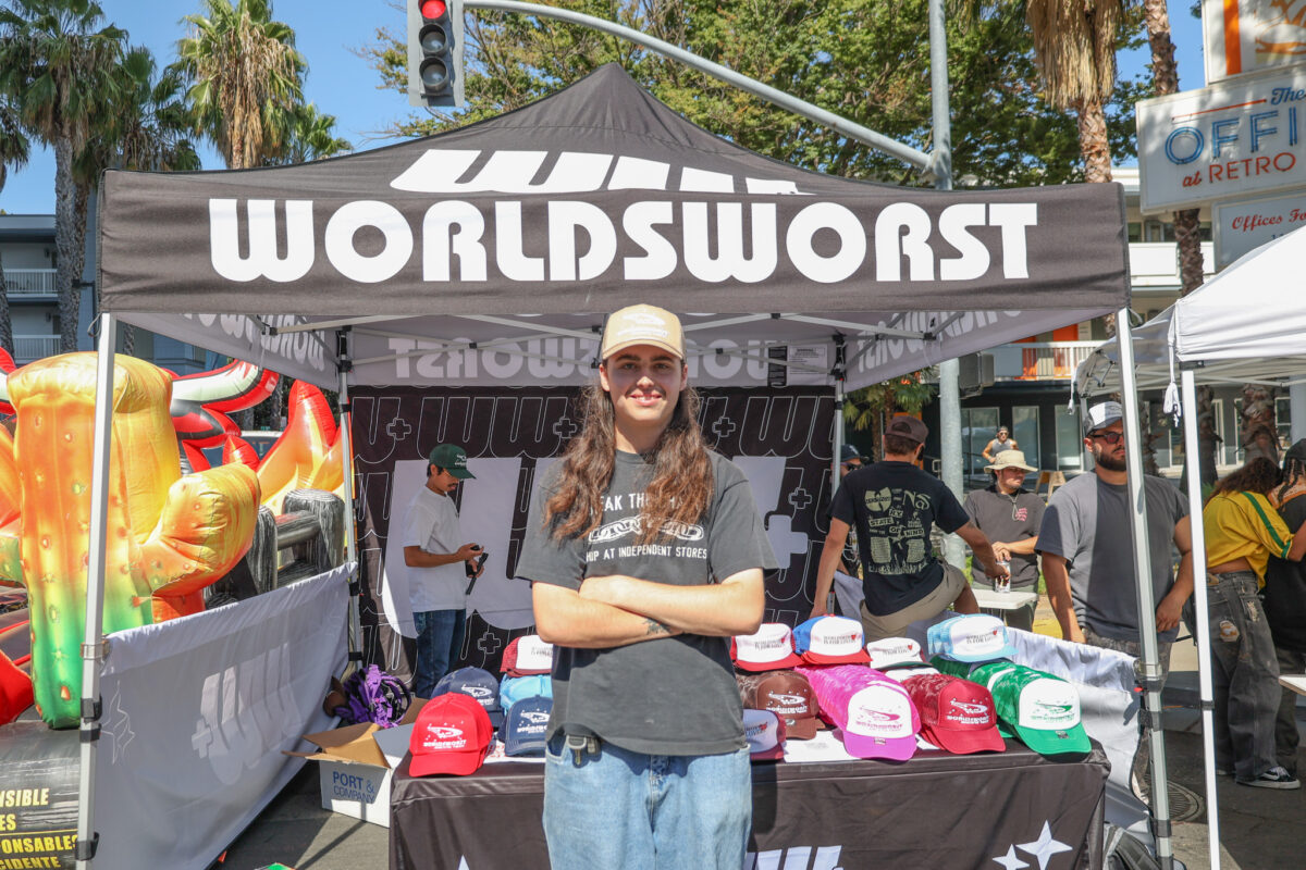 Casey Mann poses for a photograph at the World’s Worst Expo booth Saturday, Sept. 17, 2023. Mann helped organize the World’s Worst Expo this past weekend.