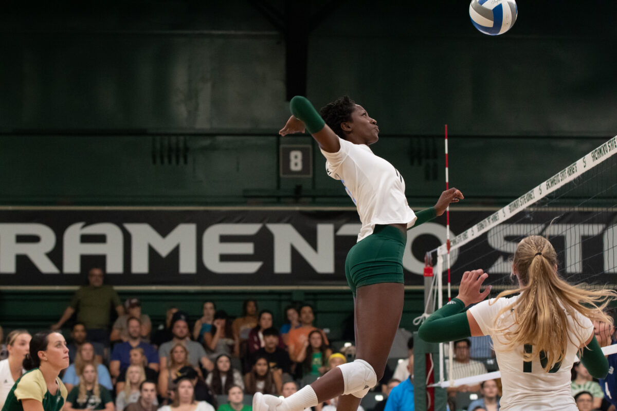Senior middle blocker Tiyanane Kamba-Griffin attempts to hit the ball over the net to the Aggies for a kill at The Nest Tuesday, Sept. 12, 2023. Kamba-Griffin had a total of eight kills and six blocks.