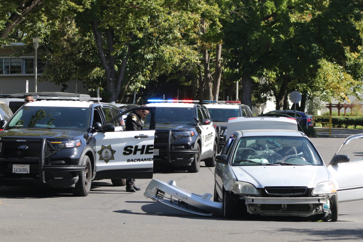 Sacramento County Sheriff deputies on the scene of an arrest following a pursuit of a stolen vehicle by Parking Structure 5, Monday, Sept. 25, 2023. A deputy on the scene said the damage to the vehicle occurred due to it hitting a pole.