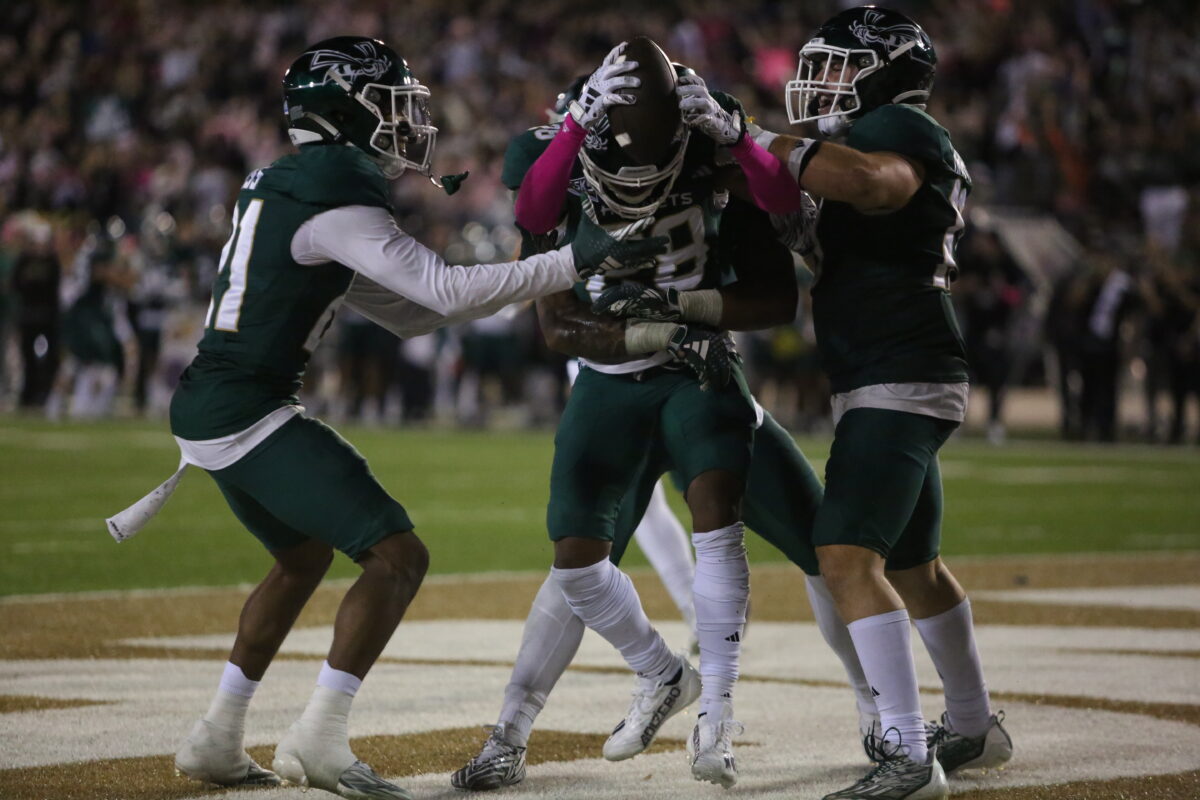 Sac State junior safety Kameron Rocha holds up the ball after his game-sealing interception Sept. 30, 2023. This was Rocha’s first career interception.