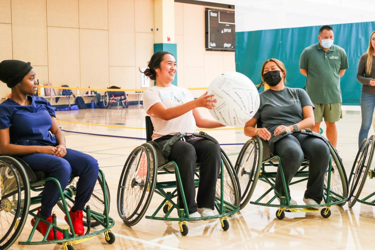 Health science major Laura Baluyut introduces herself during The WELL’s recreational therapy program on court four inside The WELL Thursday, Sept. 28, 2023. Baluyut is a student volunteer and participated in learning how to play tennis. 