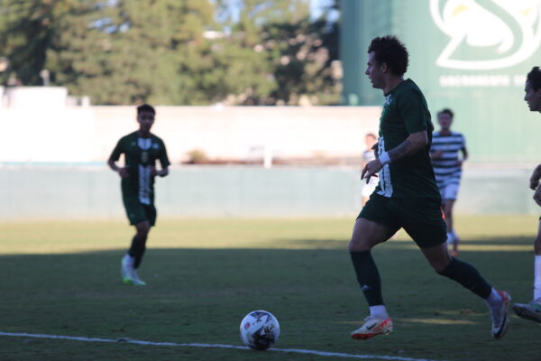 Sac State senior midfielder Cody Sundquist carries the ball up the field against Cal Poly Wednesday, Oct. 11, 2023. Sundquist played all 90 minutes for the Hornets against the Mustangs.