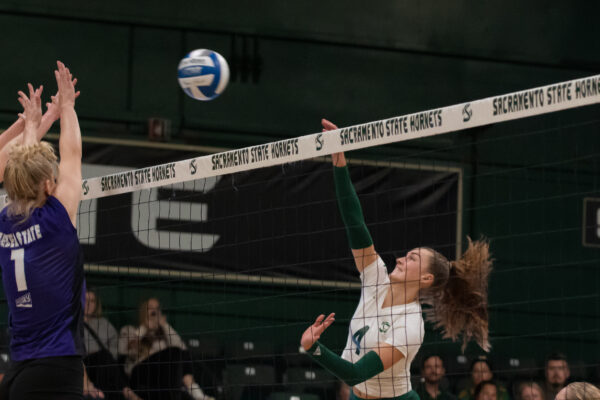Senior outside hitter Caitlin Volkmann attempts to attack the Wildcats for a kill at The Nest Thursday, Oct. 12, 2023. Volkmann had a total of 13 kills and one block in this match.