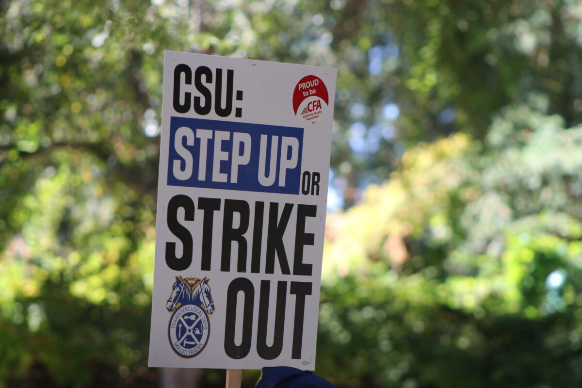 A sign held by one of the various union representatives gathering together in the Library Quad, Wednesday, Oct. 4, 2023. Organizations involved in the demonstration included the California Faculty Association, CSU Employees Union, the Teamsters Local 2010, among others.