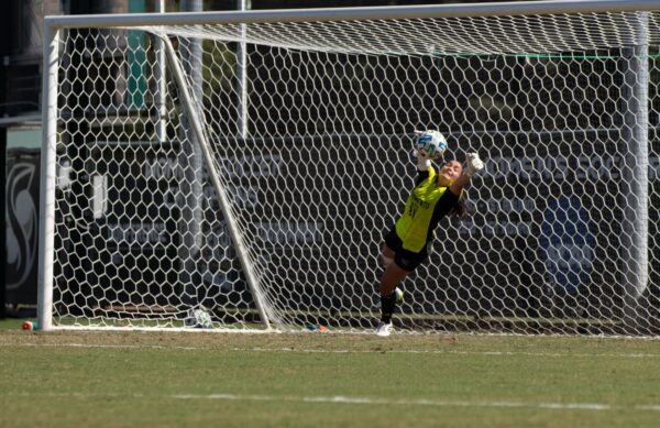 Freshman goalkeeper Izzy Palmatier diving to knock the penalty shot off target Oct. 8, 2023. Palmatier said the save was one of her favorites so far this season.