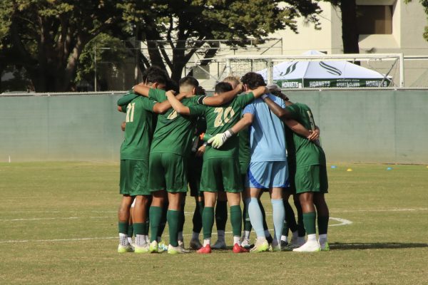 The Sacramento State men’s soccer team in a huddle before the match Saturday Oct. 21, 2023 against UC Irvine. They would end up losing to Irvine 2-0, eliminating them from playoff contention.