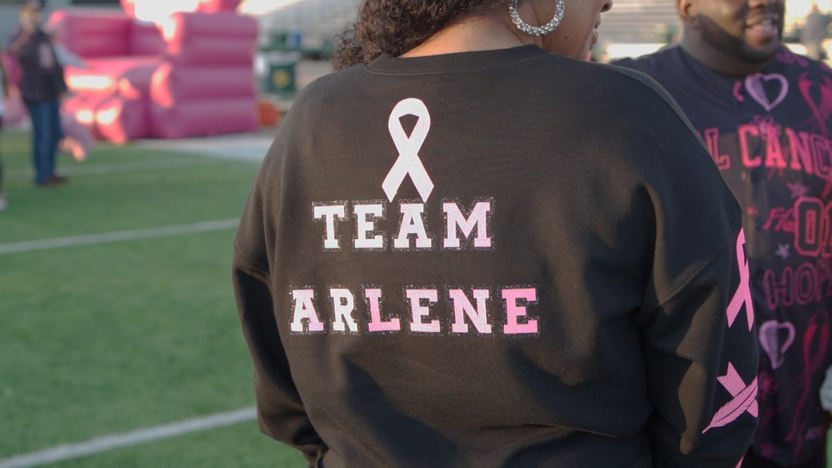 A participant and her family show off the T-shirts honoring their late grandmother Arlene at the Making Strides walk Sunday, Oct. 15, 2023. Arlene passed away from breast cancer in 2001.