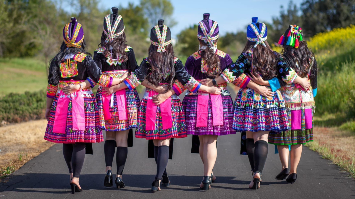 A group of Hmong women dressed in traditional Hmong clothing. Hmong clothing is known for its vibrant colors and embroidered designs that aren’t just aesthetically pleasing, but are a form of storytelling as well. (Photo courtesy of Yeng Vue.)