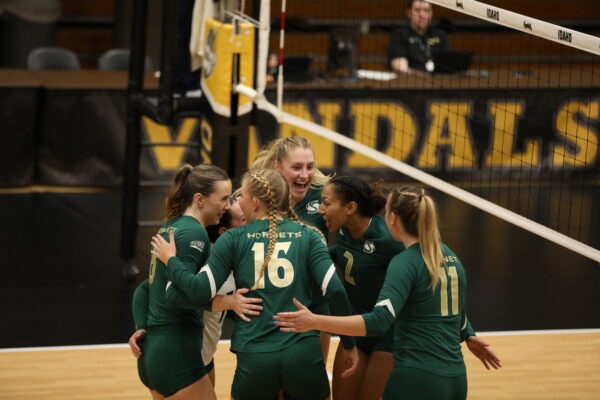 Sac State Volleyball players in the huddle during their match against the Vandals in Moscow, Idaho Thursday, Oct. 5, 2023. The Hornets swept the Vandals 3-0 to remain undefeated in the conference.