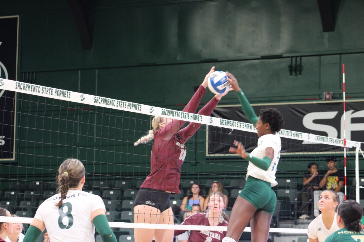 Senior middle blocker Tiyanane Kamba-Griffin blocks a ball against Montana at The Nest Thursday, Oct. 19, 2023. Kamba-Griffin had a total of six kills and four blocks.