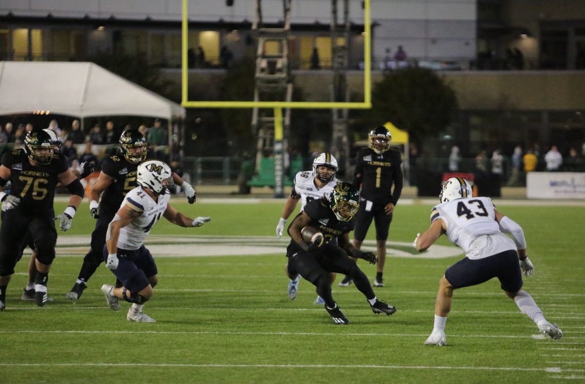 Sac State freshman running back Zeke Burnett sidesteps a Montana State defender Saturday, Oct. 21, 2023. Due to injuries in the running back room, Burnett has had to step up and has 76 yards and one touchdown.