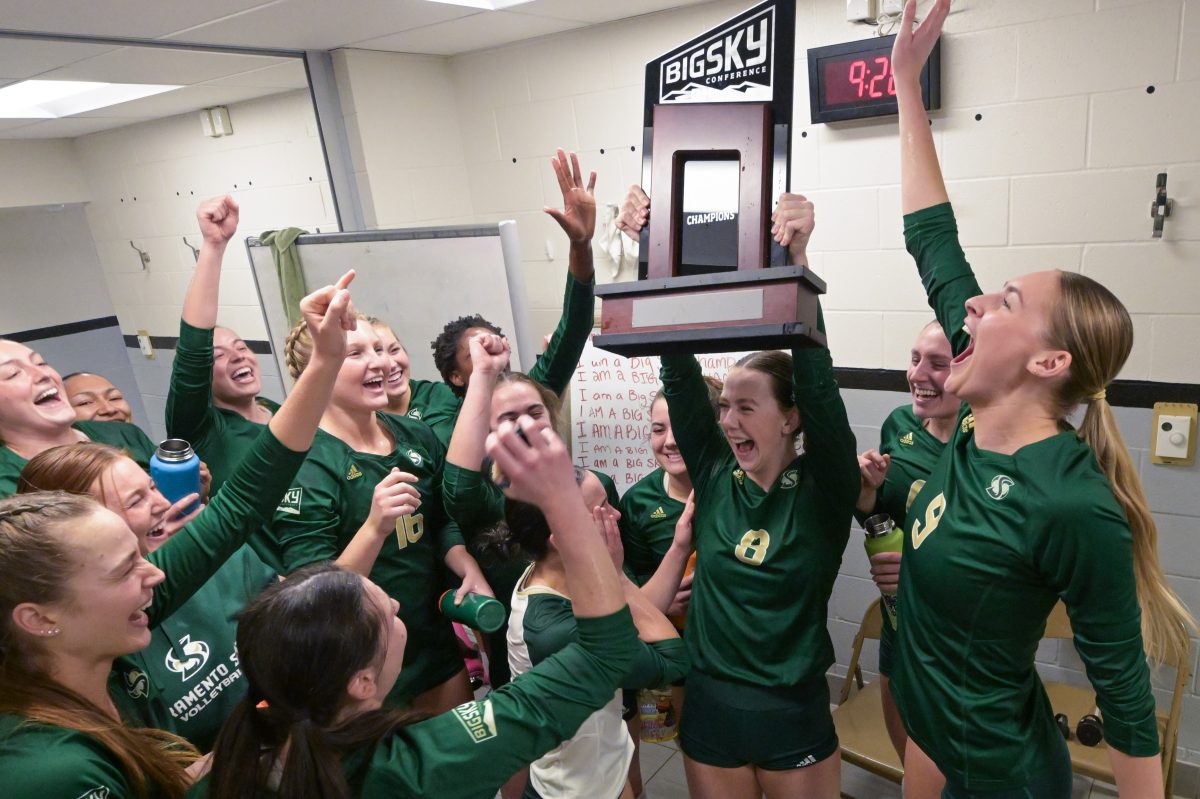 Bridgette Smith holds the trophy and celebrates with the rest of her team after defeating Montana Saturday, Nov. 18, 2023. Sac State volleyball won the Big Sky regular season title and secured the number one seed heading into the Big Sky Tournament. (Photo courtesy of Montana Athletics)