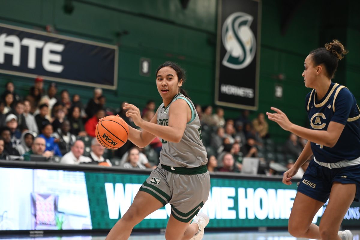 Junior guard Seilala Lautaimi drives to the basket against the Aggies at The Nest Tuesday, Nov. 21, 2023. Lautaimi had a total of 12 points and seven rebounds.