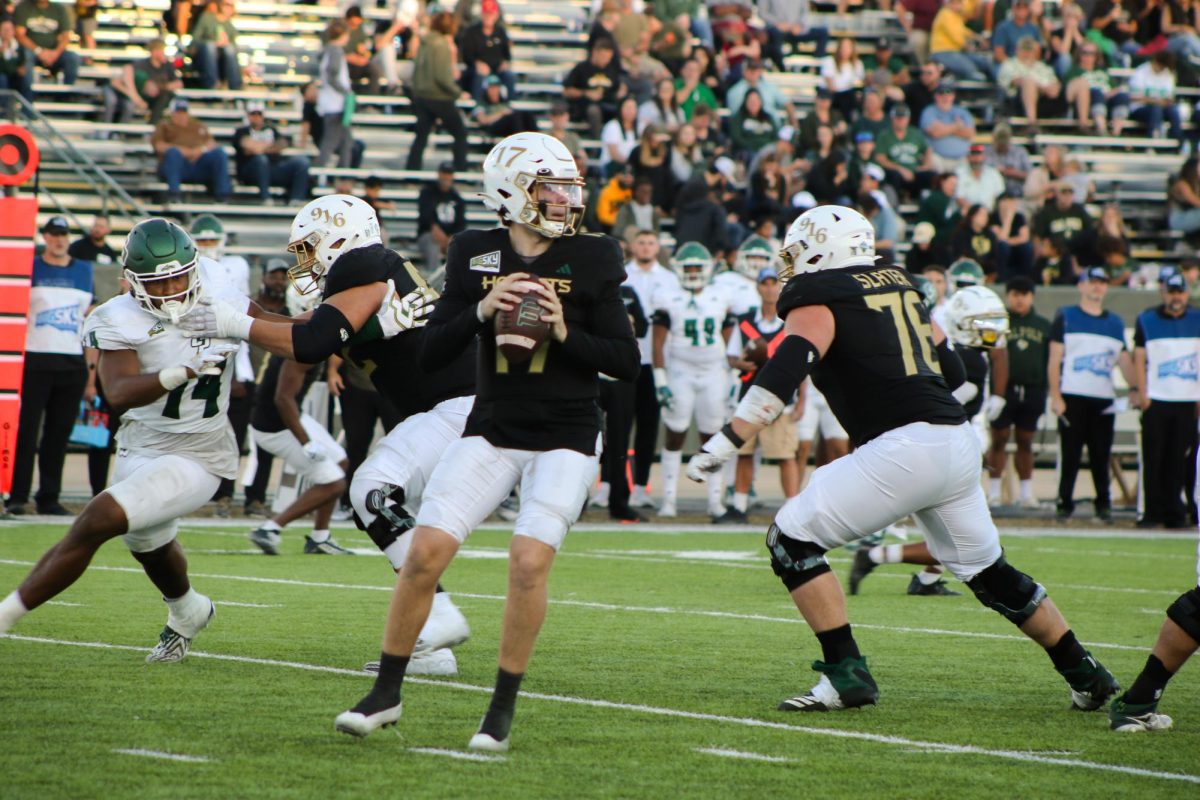 Freshman quarterback Carson Conklin looks ahead to make a pass during the Hornets’ final home game in Hornet Stadium Saturday, Nov. 11, 2023. This game marked Conklin’s first start as Sac State’s quarterback with 313 passing yards and a 65.4% completion rate. 