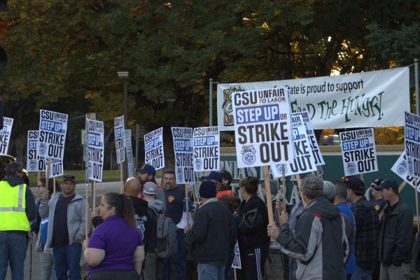 Teamsters gather at Sacramento State’s north entrance, Tuesday, Nov. 14, 2023. Members were broken into groups to occupy a corner of the intersection of J Street and State University Drive.