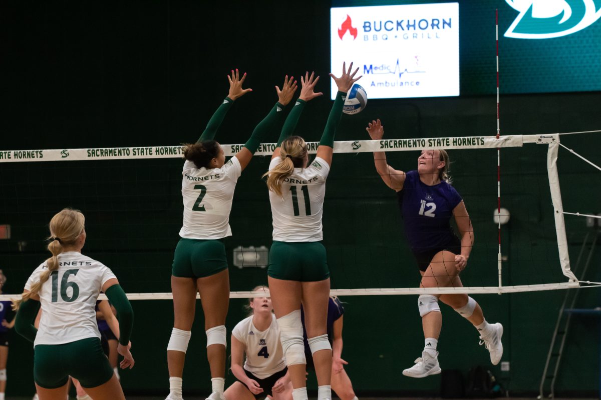 Senior middleblocker Kalani Hayes and junior outside hitter Ellie Tisko going up for a block against Weber State Saturday, Oct. 12, 2023. The Hornets played Weber State for the third time this season in the semifinals of the Big Sky Tournament and lost 3-2.
