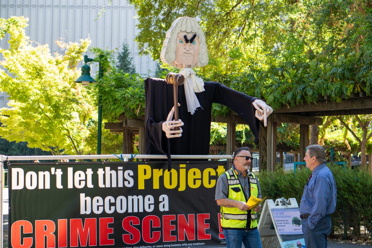 The large display of a judge put up by demonstrators in the library quad near Santa Clara Hall Oct. 11, 2023. Members of the Carpenters Local Union 46 handed out flyers alleging wage theft by contractors being considered for Student Housing Project III.