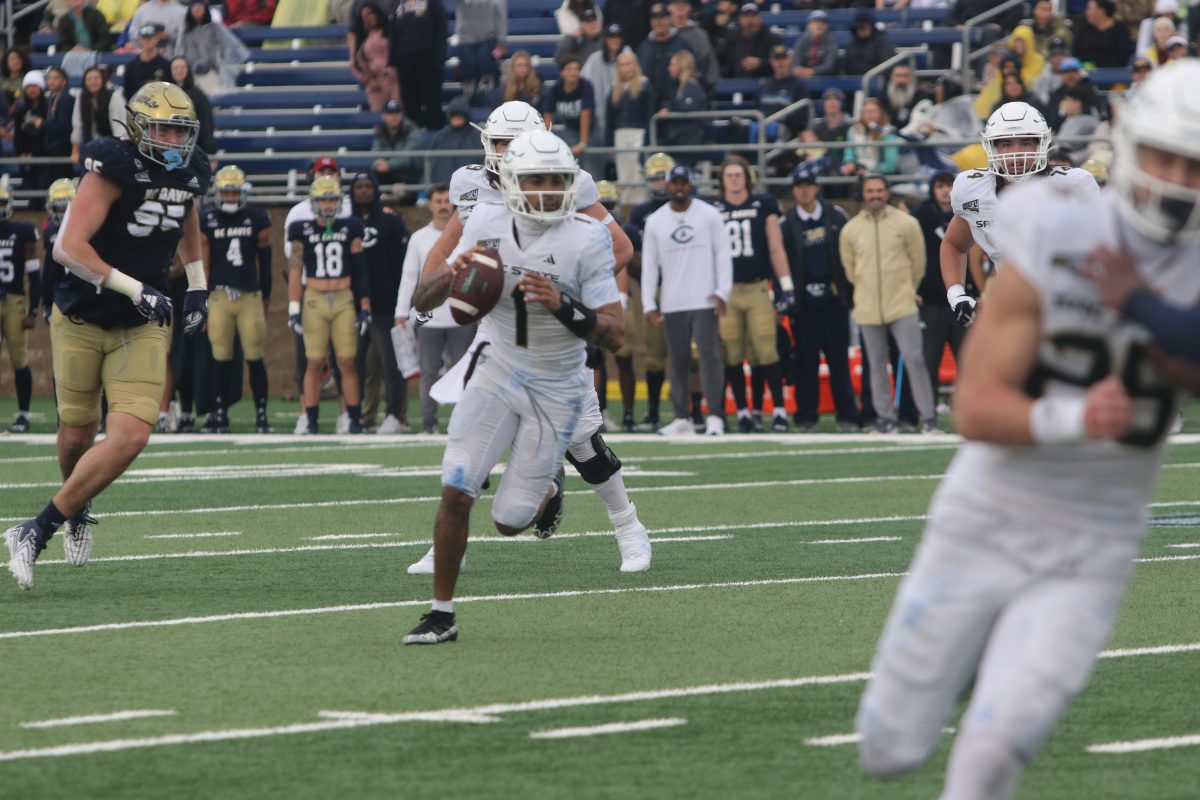 Junior quarterback Kaiden Bennett scrambles while looking downfield against UC Davis Saturday, Nov. 18, 2023. Bennett led the Sac State offense in passing yards and rushing yards in the 42-35 win over North Dakota.