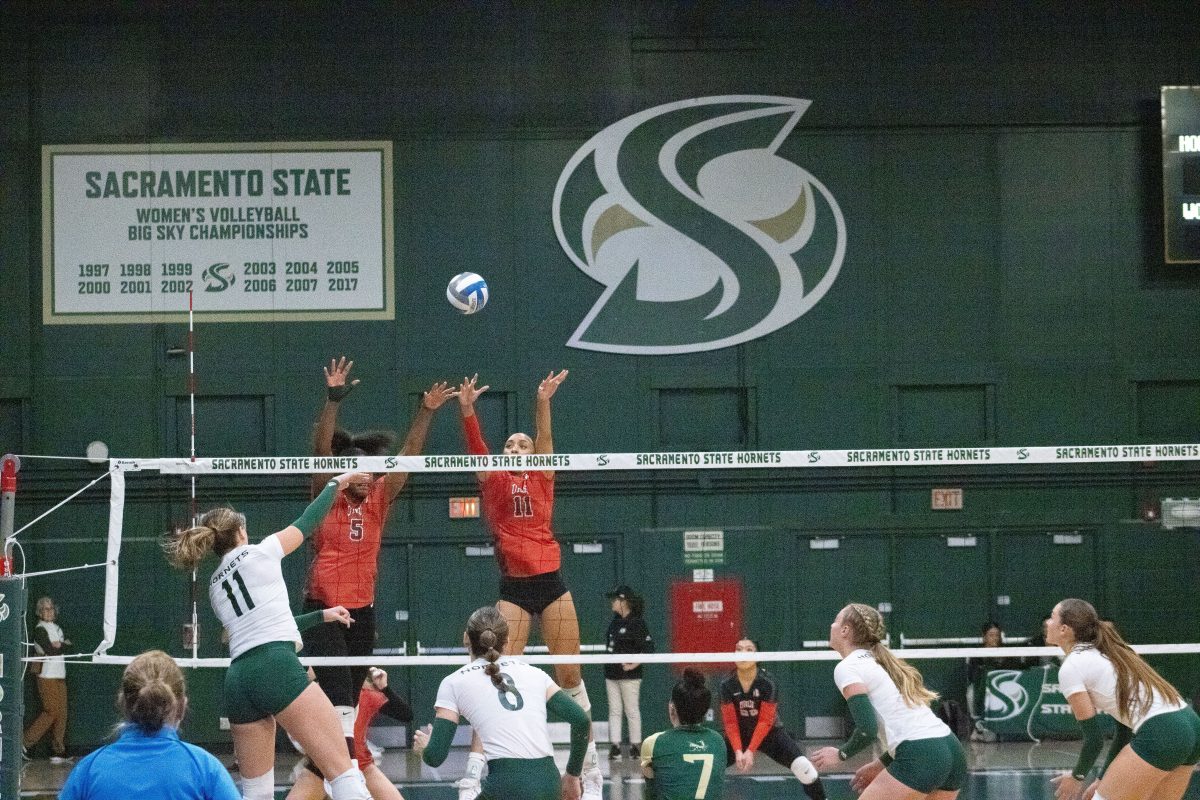Junior outside hitter Ellie Tisko goes up for a kill against two UNLV blockers in the first round of the Women’s National Invitational Volleyball Championship Thursday, Nov. 30, 2023. The Hornets would go on to win the game 3-0, but lose in the next round to Montana State.