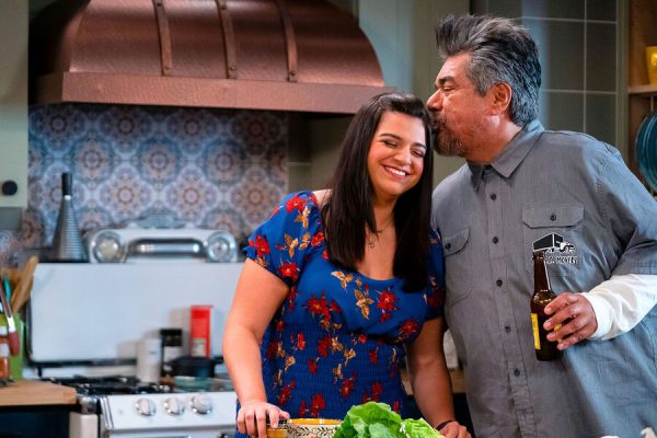 George Lopez kisses his daughter Mayan Lopez on the head after expressing how proud he is that she can speak Spanish. Mayan Lopez has been lying about being able to speak Spanish because she feels ashamed for never learning in Episode 3: Lopez vs Español. (Photo courtesy of Universal Television)