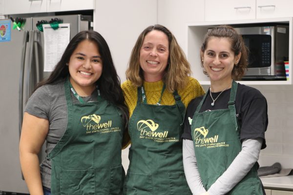 (L-R) Lead Student Assistant at Student Health, Counseling and Wellness Services Lauren Batoon, Registered Dietitian Nutritionist Jennifer Campbell and CalFresh Healthy Living Student Assistant Macey Briones in The Cove Kitchen on the first floor at The WELL Tuesday, Nov. 28, 2023. Campbell is the supervisor for the cooking demos in The Cove Kitchen. (Photo by Alyssa Branum)