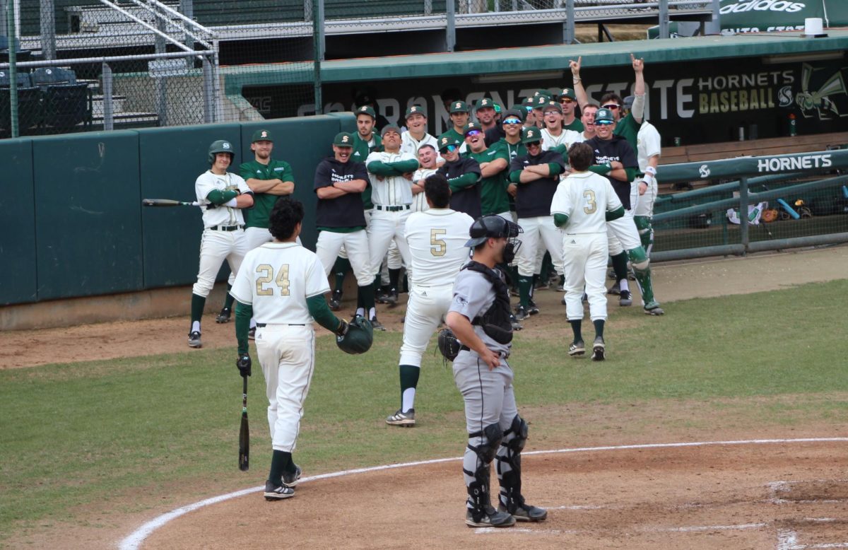 Sac State mimics the celebration of sophomore first baseman JP Smith after his home run against Utah Valley on Sunday, March 10, 2024. Smith went three for five and scored three times against the Wolverines in the third game of the series.