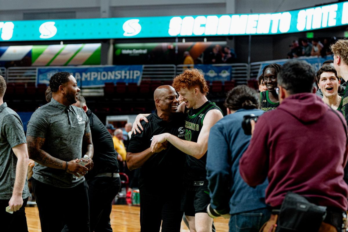 Sac State head coach David Patrick and junior guard Austin Patterson embrace after the Hornets’ huge win over top-seeded Eastern Washington on Sunday, March 10, 2024. Sac State will now advance to the semifinals on Tuesday.