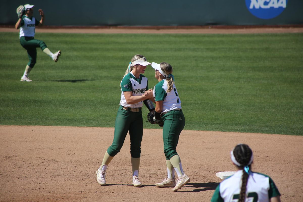Junior shortstop Gwen Ludwig and Sophomore second baseman Jenna Birch celebrate an out at Shea Stadium Friday, April 12, 2024. Sacramento State beat Portland State in game one before falling in game two, their record sits at 22-16.
