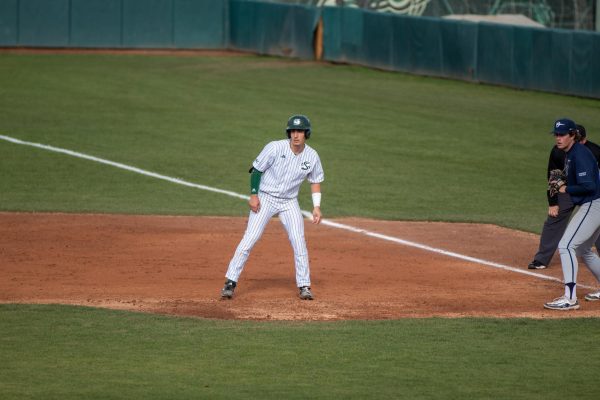 Junior catcher Elie Kligman taking a lead at first base at John Smith Field against California Baptist University Friday, April 5, 2024. Kligman is the second player on the team who can switch hits along with senior shortstop Gunner Gouldsmith.