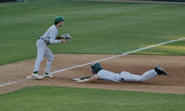 Redshirt freshman center fielder Brett Ott sliding into third base on a close play against the University of San Francisco Monday, April 1, 2024. Ott went one for four and scored two runs against the USF.