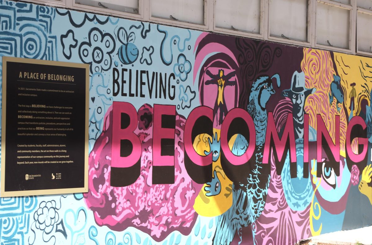 The ‘BECOMING’ mural is a central focal point of the murals revealed near the University Union and was created by Heather Hogan, a professor at Sacramento City College Wednesday, April 10, 2024. The murals are the second installment of the university’s “A Place of Belonging Murals” multiyear mural project. 