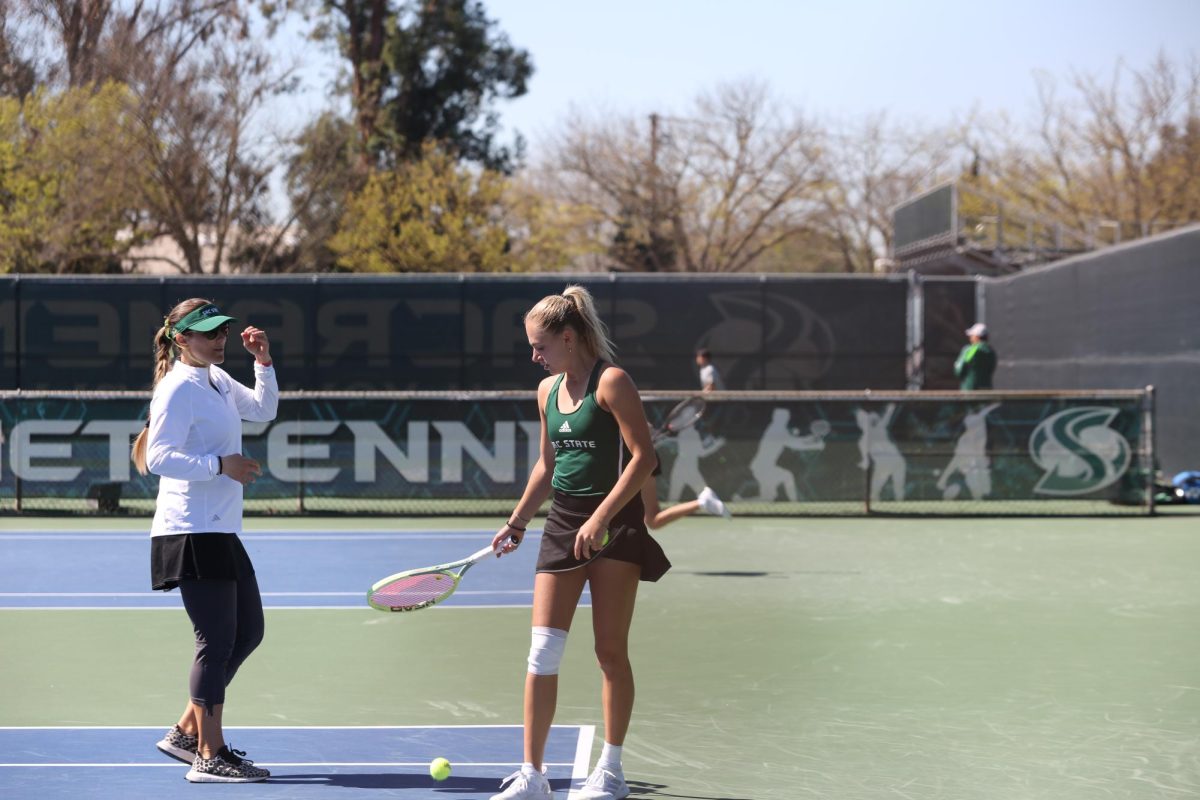 Redshirt freshman Lou Baudouin with head coach Sophie Breault during her match against Weber State at the Sacramento State Tennis Courts Saturday, March 16, 2024. Baudouin was an integral part of Sac State’s Big Sky Championship winning season. 